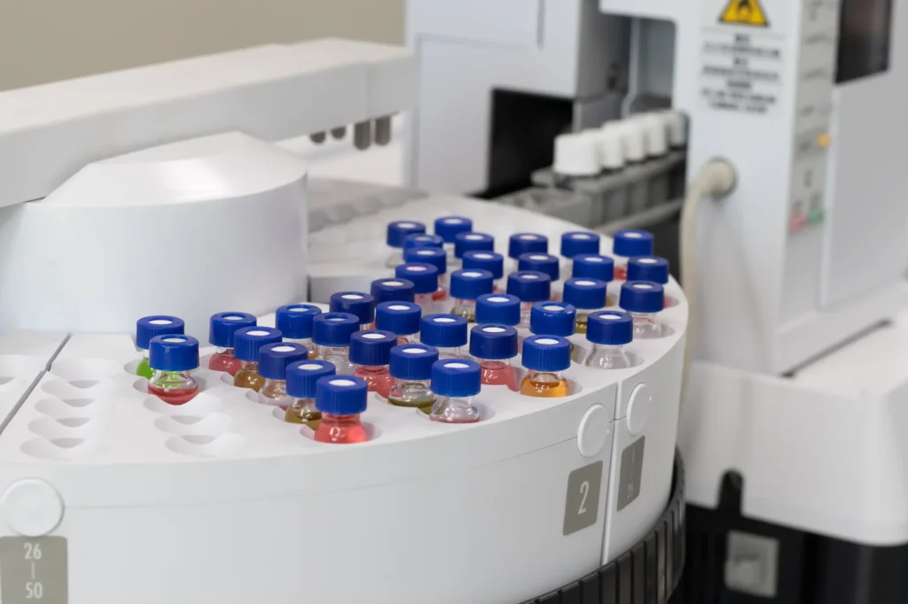 Liquid chromatography autosampler with sample vials, analytical development